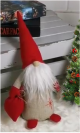 FIG403RD14 / Santa gnome with a red hat & a bag of presents