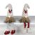 Fabric sitting Santa gnome with a fur hat 20